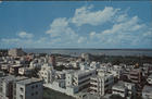 Lourenço Marques : alto do Bairro da Maxaquene... / diapositivo de Vasco Campos. - Lourenço Marques : Focarte, 1961. - 1 postal : color. ; 9x14 cm. - (Cores de Moçambique)