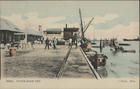 Beira, custom house pier. - Beira : J. Perrin, [ca 1908]. - 1 postal : color. ; 9x14 cm